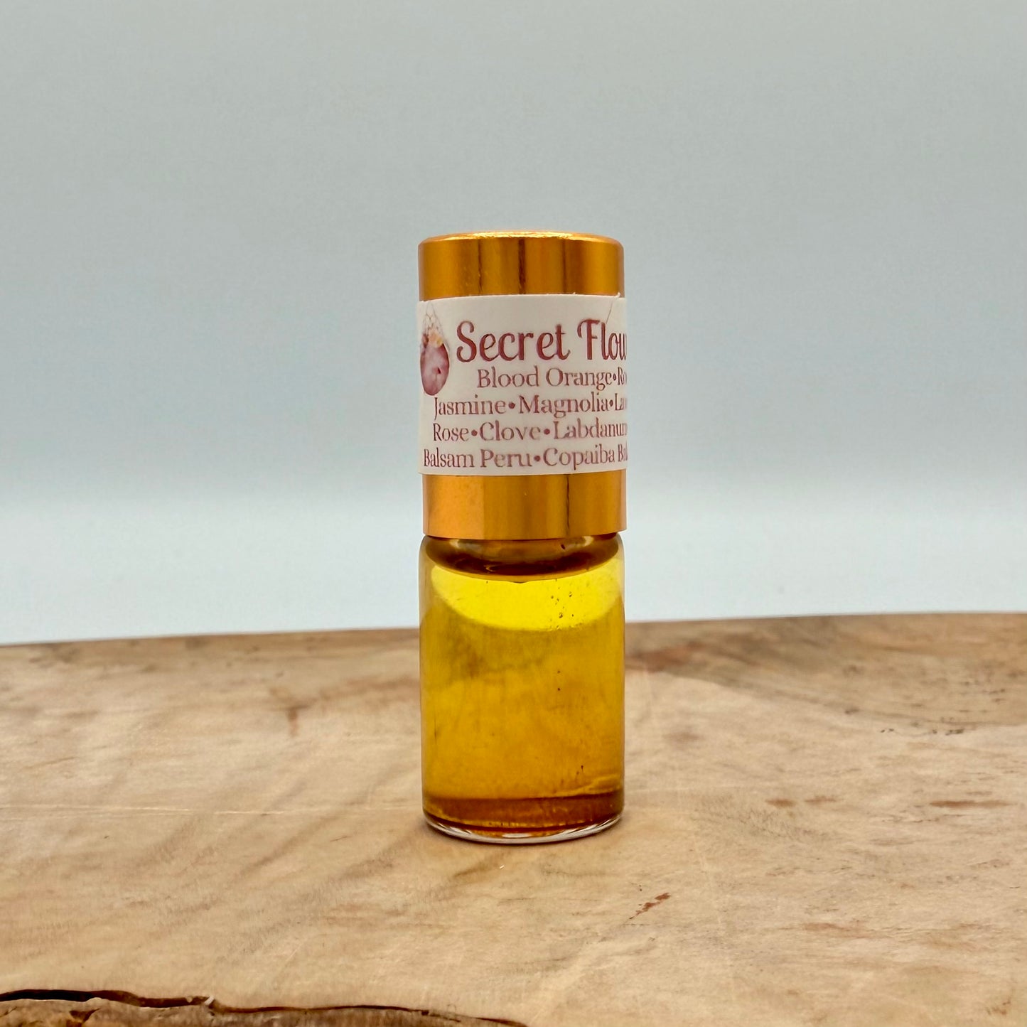 SECRET FLOWER MOON- Geranium, Blood Orange, Lavender Absolute, Damask Rose, Jasmine, Southern Magnolia Blossom, Golden Ylang ylang, Spiced Clove Bud, Smoky Labdanum, Balsam Peru, Copaiba Balsam, Pink Carnation, Madagascar Vanilla Bean, Aged Oak Moss
